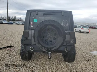 2017 Jeep Wrangler Willys Wheeler with VIN 1C4AJWAG9HL673766, listed as a Copart auction lot 43132555 with 129,422 mi miles and Salvage Title. Bid and sale history available at DreamBid. Image 6.