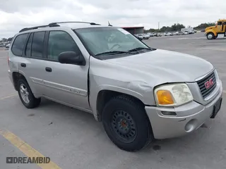 2004 GMC Envoy SLE with VIN 1GKDS13S642247715, listed as a IAAI auction lot 41472984 with 240,550 mi miles. Bid and sale history available at carsss.com. Image 1.