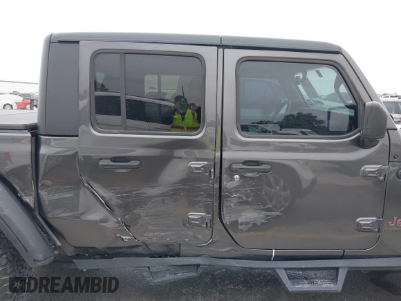 2020 Jeep Gladiator Rubicon with VIN 1C6JJTBG8LL135573, listed as a IAAI auction lot 41585896 with 79,070 mi miles and . Bid and sale history available at DreamBid. Image 13.