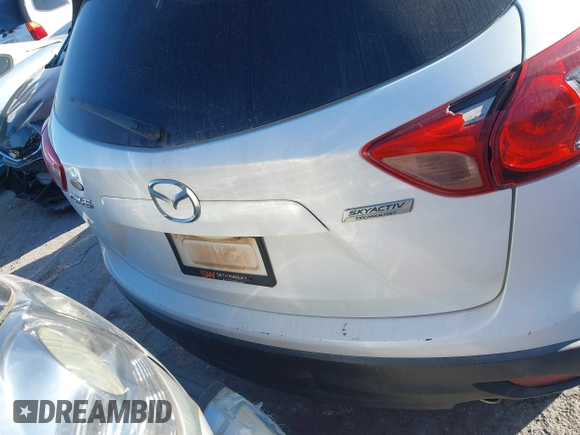 2016 Mazda CX-5 Touring z VIN JM3KE2CY9G0807688, wystawiony jako IAAI lot #41039438 z przebiegiem 169 483 mil mil oraz . Historia ofert i sprzedaży dostępna na DreamBid. Obrazek 17.