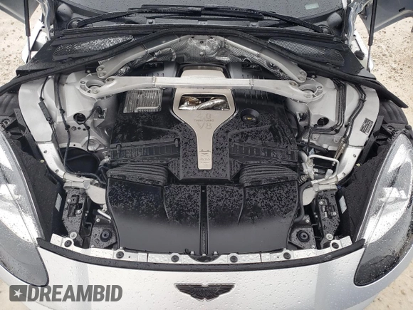 2021 Aston Martin DBX z VIN SCFVUJAW4MTV03930, wystawiony jako Copart lot #73946614 z przebiegiem Nie podano mil oraz Nie do naprawy. Historia ofert i sprzedaży dostępna na DreamBid. Obrazek 12.