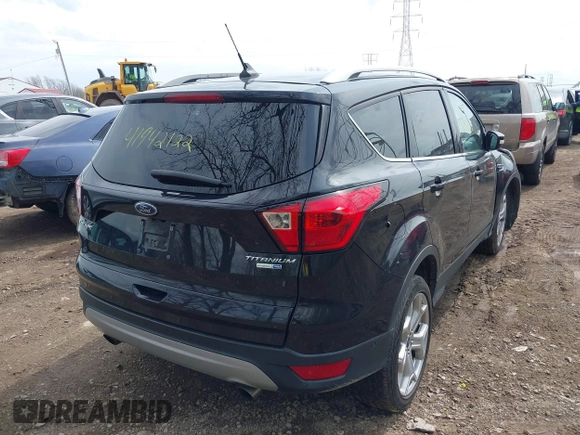 2019 Ford Escape Titanium with VIN 1FMCU9J91KUC42161, listed as a IAAI auction lot 41942122 with 100,677 mi miles and . Bid and sale history available at DreamBid. Image 4.