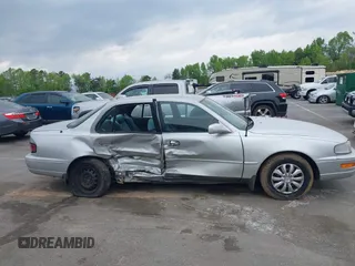 1993 Toyota Camry LE z VIN 4T1SK12E0PU290398, wystawiony jako IAAI lot #42032664 z przebiegiem 264 922 mil mil oraz . Historia ofert i sprzedaży dostępna na DreamBid. Obrazek 13.