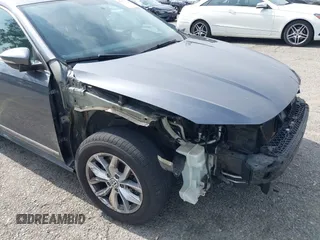 2016 Volkswagen Passat S with VIN 1VWAT7A36GC031403, listed as a IAAI auction lot 42371103 with 86,454 mi miles and . Bid and sale history available at DreamBid. Image 6.