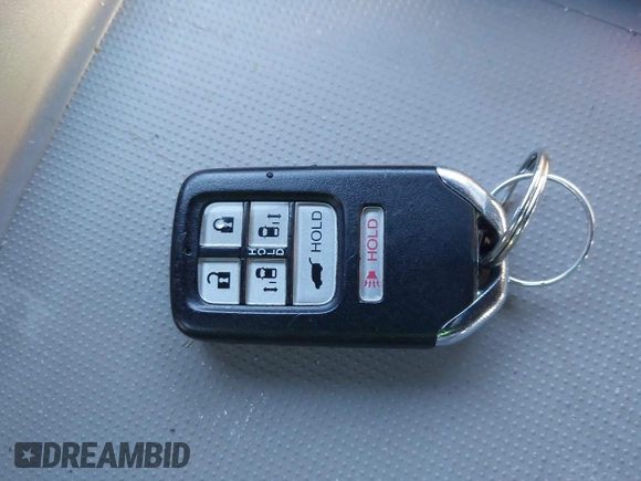 2014 Honda Odyssey Touring with VIN 5FNRL5H94EB081267, listed as a IAAI auction lot 41199509 with 146,827 mi miles and . Bid and sale history available at DreamBid. Image 11.