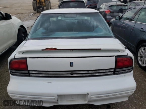 1997 Oldsmobile Cutlass Supreme S z VIN 1G3WH52M2VF322529, wystawiony jako Copart lot #52003574 z przebiegiem 140 292 mil mil oraz Szkody całkowita. Historia ofert i sprzedaży dostępna na DreamBid. Obrazek 6.
