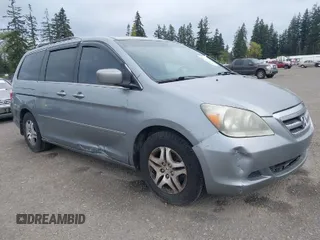 2007 Honda Odyssey EX-L with VIN 5FNRL38777B075985, listed as a IAAI auction lot 42083450 with 127,622 mi miles. Bid and sale history available at carsss.com. Image 1.