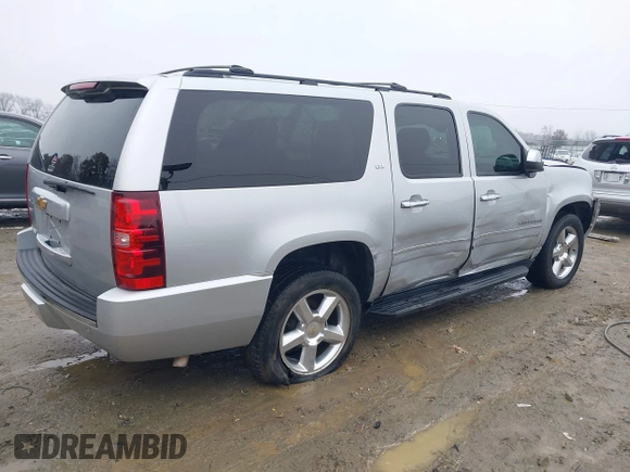 2014 Chevrolet Suburban LTZ with VIN 1GNSCKE05ER173446, listed as a IAAI auction lot 41047096 with 189,049 mi miles and . Bid and sale history available at DreamBid. Image 4.