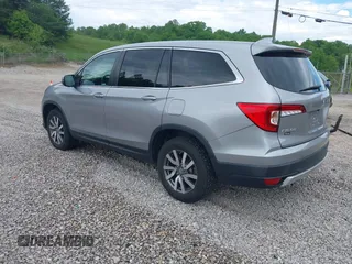 2021 Honda Pilot EX-L with VIN 5FNYF6H50MB063465, listed as a IAAI auction lot 42160636 with 28,595 mi miles and . Bid and sale history available at DreamBid. Image 3.