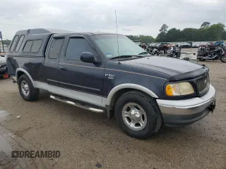 2000 Ford F-150 XL with VIN 1FTRX17L7YNC24292, listed as a Copart auction lot 58852925 with 213,318 mi miles and Salvage title. Bid and sale history available at DreamBid. Image 4.