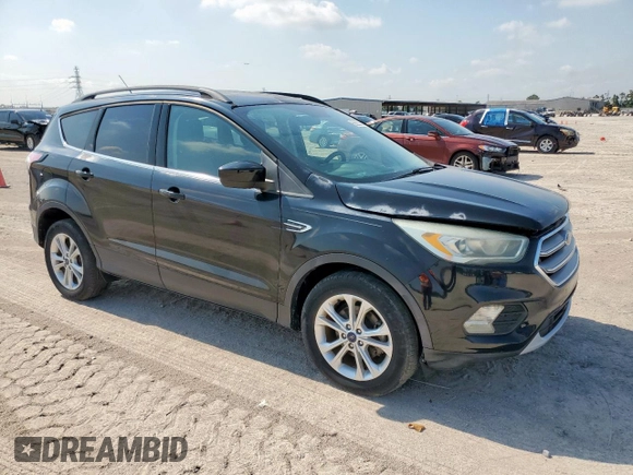 2017 Ford Escape SE z VIN 1FMCU0GD2HUC07371, wystawiony jako Copart lot #59223875 z przebiegiem 26 805 mil mil oraz Szkoda całkowita • Salvage title. Historia ofert i sprzedaży dostępna na DreamBid. Obrazek 4.