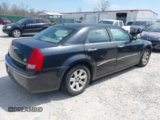 2006 Chrysler 300 Touring with VIN 2C3LA53G66H329729, listed as a IAAI auction lot 41946723 with 134,465 mi miles. Bid and sale history available at carsss.com. Image 4.