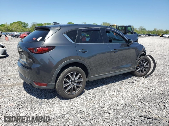 2018 Mazda CX-5 Grand Touring z VIN JM3KFBDM3J0351106, wystawiony jako Copart lot #52553925 z przebiegiem Nie podano mil oraz Szkoda całkowita • Salvage title. Historia ofert i sprzedaży dostępna na DreamBid. Obrazek 3.