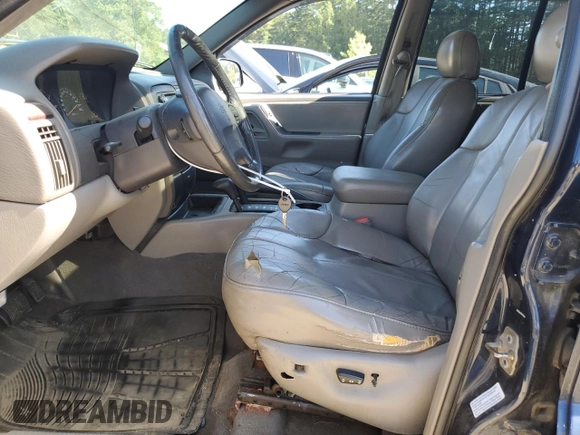 2000 Jeep Grand Cherokee Laredo with VIN 1J4GW48S2YC398116, listed as a Copart auction lot 61828385 with 251,791 mi miles and Clean title. Bid and sale history available at DreamBid. Image 7.