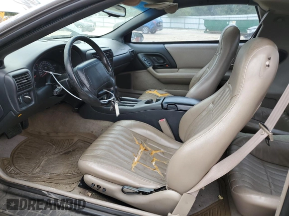 1997 Chevrolet Camaro Z28 z VIN 2G1FP22P6V2156828, wystawiony jako Copart lot #57651625 z przebiegiem 131 803 mil mil oraz Szkoda całkowita • Salvage title. Historia ofert i sprzedaży dostępna na DreamBid. Obrazek 7.