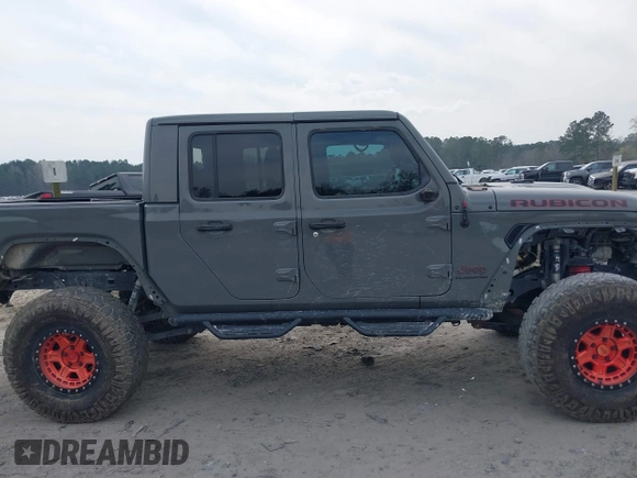 2021 Jeep Gladiator Rubicon with VIN 1C6JJTBG7ML554354, listed as a IAAI auction lot 41796943 with 61,513 mi miles and . Bid and sale history available at DreamBid. Image 14.