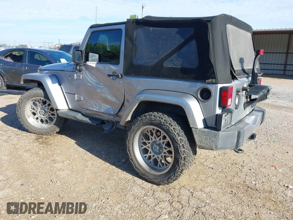 2016 Jeep Wrangler Sahara z VIN 1C4AJWBGXGL120329, wystawiony jako IAAI lot #40239916 z przebiegiem 96 731 mil mil oraz . Historia ofert i sprzedaży dostępna na DreamBid. Obrazek 3.