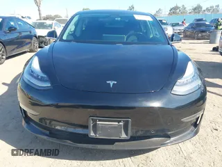2018 Tesla Model 3 Long Range Battery with VIN 5YJ3E1EA0JF056979, listed as a IAAI auction lot 41865849 with 97,319 mi miles. Bid and sale history available at carsss.com. Image 12.