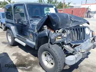 2001 Jeep Wrangler Sahara with VIN 1J4FA59SX1P337951, listed as a IAAI auction lot 42087134 with 154,479 mi miles and . Bid and sale history available at carsss.com. Image 1.