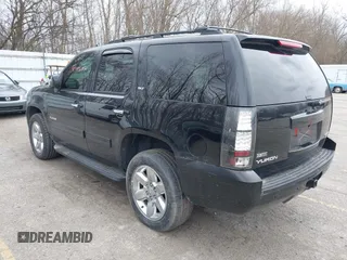 2011 GMC Yukon SLT with VIN 1GKS2CE01BR347675, listed as a IAAI auction lot 41931635 with 247,817 mi miles. Bid and sale history available at carsss.com. Image 3.