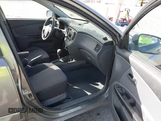 2010 Kia Rio LX with VIN KNADH4A34A6674027, listed as a IAAI auction lot 41804686 with 113,528 mi miles. Bid and sale history available at carsss.com. Image 5.