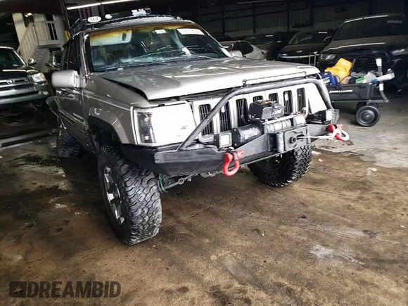 1998 Jeep Grand Cherokee Limited with VIN 1J4GZ78S9WC308708, listed as a Copart auction lot 79315694 with 205,976 mi miles and Salvage title. Bid and sale history available at DreamBid. Image 12.