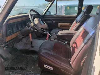 1987 Jeep Grand Wagoneer с VIN 1JCNJ15UXHT013691, выставлен на аукционе Copart как лот 59439595 с пробегом 174 941 миль миль и Чистый • Clean title. История ставок и продаж доступна на DreamBid. Изображение 7.