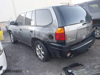 2005 GMC Envoy SLE with VIN 1GKDS13S352215032, listed as a IAAI auction lot 41221612 with 260,647 mi miles. Bid and sale history available at carsss.com. Image 3.