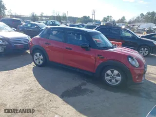 2015 MINI Cooper Hardtop 4 Door with VIN WMWXS5C54FT827954, listed as a IAAI auction lot 41701342 with 122,182 mi miles. Bid and sale history available at carsss.com. Image 1.