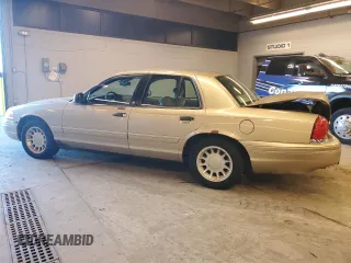 2000 Ford Crown Victoria LX z VIN 2FAFP74WXYX116130, wystawiony jako Copart lot #79441204 z przebiegiem 128 133 mil mil oraz Szkoda całkowita • Salvage title. Historia ofert i sprzedaży dostępna na DreamBid. Obrazek 2.