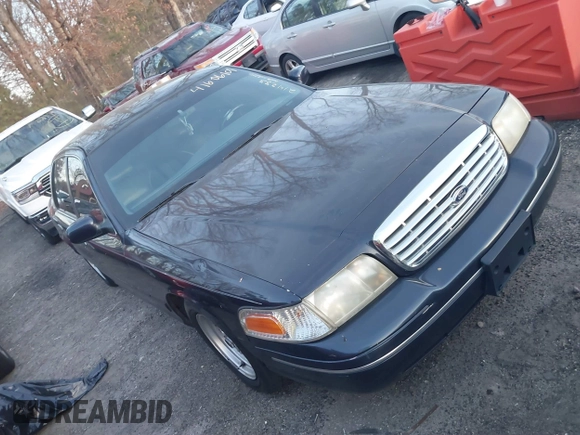 2000 Ford Crown Victoria LX z VIN 2FAFP74W6YX214233, wystawiony jako IAAI lot #41606101 z przebiegiem 106 617 mil mil oraz . Historia ofert i sprzedaży dostępna na DreamBid. Obrazek 1.