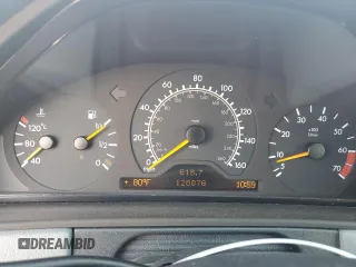 1999 Mercedes-Benz E-Class with VIN WDBJH65F1XA811693, listed as a Copart auction lot 69370604 with 128,876 mi miles and Salvage Title. Bid and sale history available at carsss.com. Image 9.