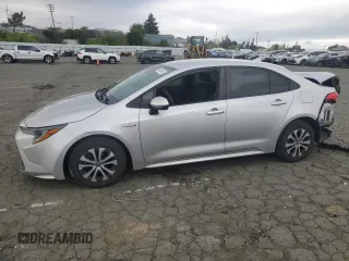 2020 Toyota Corolla Hybrid LE with VIN JTDEBRBE2LJ010220, listed as a Copart auction lot 50798575 with 128,306 mi miles and Salvage Title. Bid and sale history available at carsss.com. Image 1.