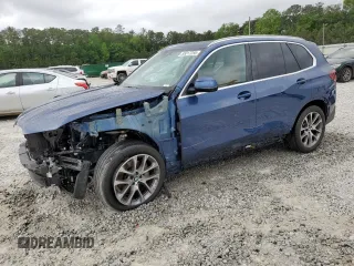 2023 BMW X5 xDrive40i с VIN 5UXCR6C00P9R60926, выставлен на аукционе Copart как лот 55017255 с пробегом 27 888 миль миль и Списание • Salvage title. История ставок и продаж доступна на DreamBid. Изображение 1.