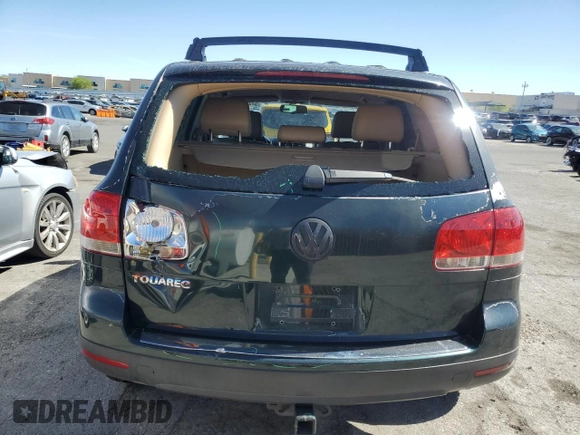 2005 Volkswagen Touareg z VIN WVGBG77L25D010568, wystawiony jako Copart lot #57268755 z przebiegiem 229 928 mil mil oraz Szkoda całkowita • Salvage title. Historia ofert i sprzedaży dostępna na DreamBid. Obrazek 6.