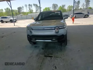 2025 Rivian R1S Adventure z VIN 7PDSGBBA9SN052652, wystawiony jako Copart lot #51659315 z przebiegiem 4012 mil mil oraz Szkody całkowita. Historia ofert i sprzedaży dostępna na DreamBid. Obrazek 11.