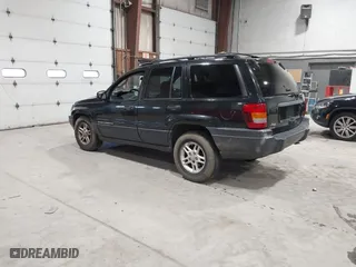 2003 Jeep Grand Cherokee Laredo with VIN 1J4GW48S63C552366, listed as a IAAI auction lot 41861501 with 227,464 mi miles. Bid and sale history available at carsss.com. Image 3.