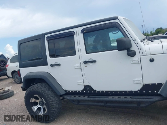 2011 Jeep Wrangler Unlimited Rubicon with VIN 1J4BA6H10BL536027, listed as a IAAI auction lot 42567901 with 164,487 mi miles and . Bid and sale history available at DreamBid. Image 13.