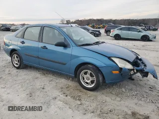 2001 Ford Focus LX with VIN 1FAHP33P01W332260, listed as a Copart auction lot 83221654 with 104,028 mi miles and Salvage Title. Bid and sale history available at DreamBid. Image 4.