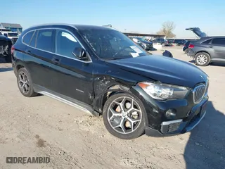 2018 BMW X1 sDrive28i with VIN WBXHU7C37J5H43318, listed as a IAAI auction lot 41294730 with 73,600 mi miles. Bid and sale history available at carsss.com. Image 1.