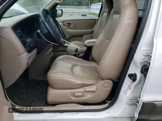 2001 Mazda Tribute LX with VIN 4F2CU08101KM11452, listed as a Copart auction lot 76796064 with 175,584 mi miles and Salvage Title. Bid and sale history available at DreamBid. Image 7.