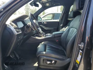 2021 BMW X5 xDrive40i with VIN 5UXCR6C06M9H65380, listed as a Copart auction lot 57445405 with 33,916 mi miles and Salvage title. Bid and sale history available at DreamBid. Image 7.