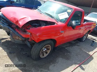 2002 Mazda B-Series Truck SX with VIN 4F4YR12D02TM01264, listed as a IAAI auction lot 41908459 with 205,445 mi miles and . Bid and sale history available at DreamBid. Image 18.