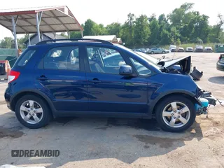 2011 Suzuki SX4 Crossover with VIN JS2YB5A38B6301589, listed as a IAAI auction lot 40112766 with 128,323 mi miles. Bid and sale history available at carsss.com. Image 14.
