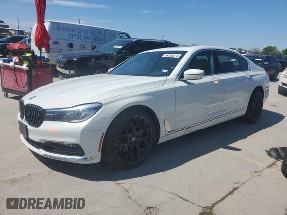 2018 BMW 7 Series 740i xDrive with VIN WBA7E4C52JGV24125, listed as a Copart auction lot 48164214 with 77,695 mi miles. Bid and sale history available at carsss.com. Image 1.