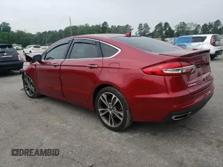 2019 Ford Fusion Titanium z VIN 3FA6P0D99KR221328, wystawiony jako Copart lot #57104515 z przebiegiem 138 427 mil mil oraz Szkoda całkowita • Salvage title. Historia ofert i sprzedaży dostępna na DreamBid. Obrazek 2.