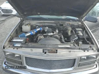 1999 GMC Yukon with VIN 1GKEK13R9XJ740395, listed as a Copart auction lot 83801394 with 185,305 mi miles and Salvage Title. Bid and sale history available at carsss.com. Image 12.