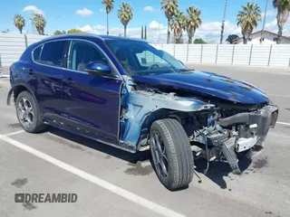 2019 Alfa Romeo Stelvio z VIN ZASPAKAN4K7C49999, wystawiony jako IAAI lot #41923216 z przebiegiem 59 802 mil mil oraz . Historia ofert i sprzedaży dostępna na DreamBid. Obrazek 1.