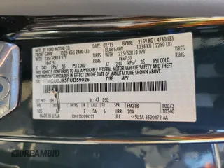 2015 Ford Escape Titanium with VIN 1FMCU0J95FUB59026, listed as a Copart auction lot 65047545 with 84,259 mi miles and Salvage title. Bid and sale history available at DreamBid. Image 13.