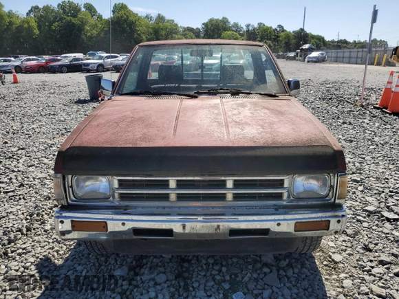 1991 Nissan Frontier XE with VIN 1N6SD11S2MC412375, listed as a Copart auction lot 61015515 with 201,629 mi miles and Salvage title. Bid and sale history available at DreamBid. Image 5.